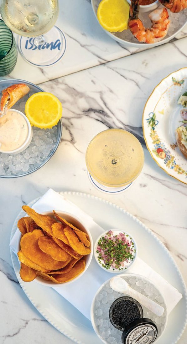 A selection of nibbles—including the caviar chips and dip—at Issima PHOTO COURTESY OF BOUJIS GROUP